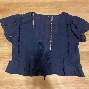 Navy blue tie around top